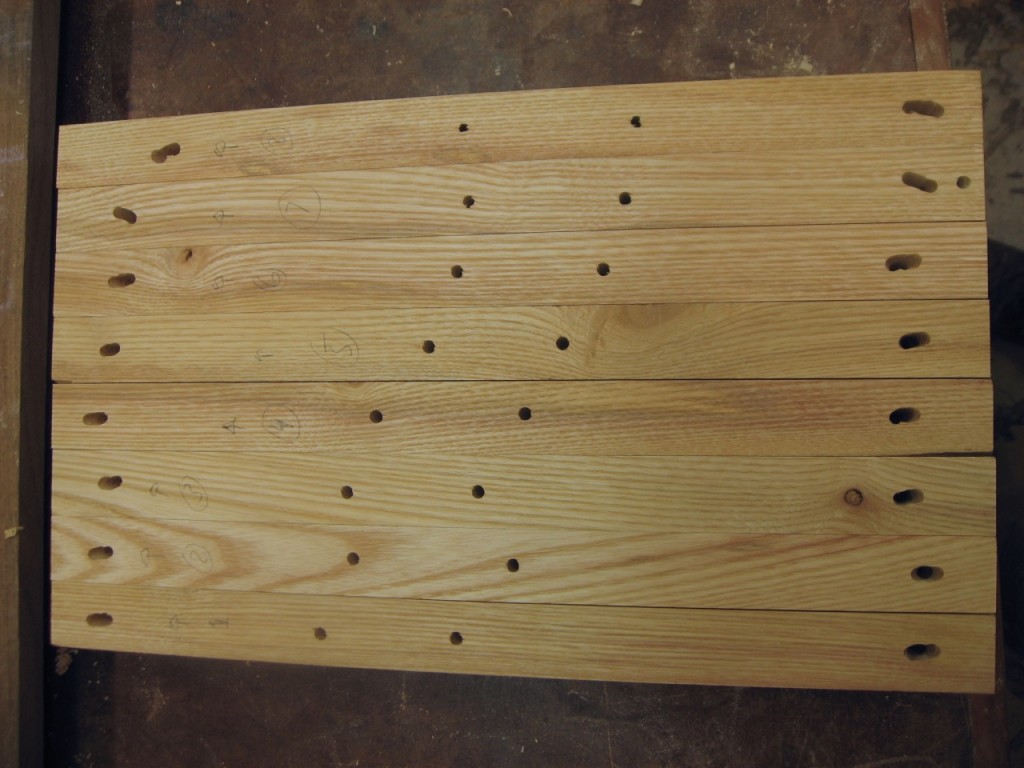 I elongate the holes at the outer edges to allow for wood movement.