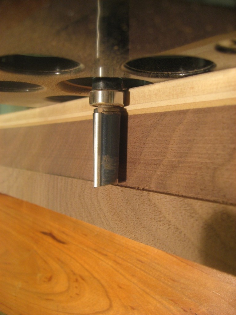 A pattern router bit rides on the template to flush up the workpiece.
