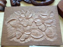 A flower carving by Mary May.