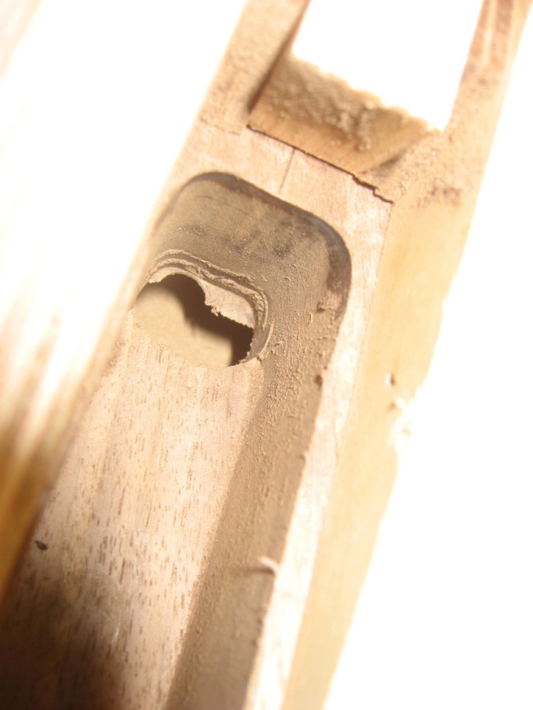 Angled top to the mortise, poking through the other side of the leg