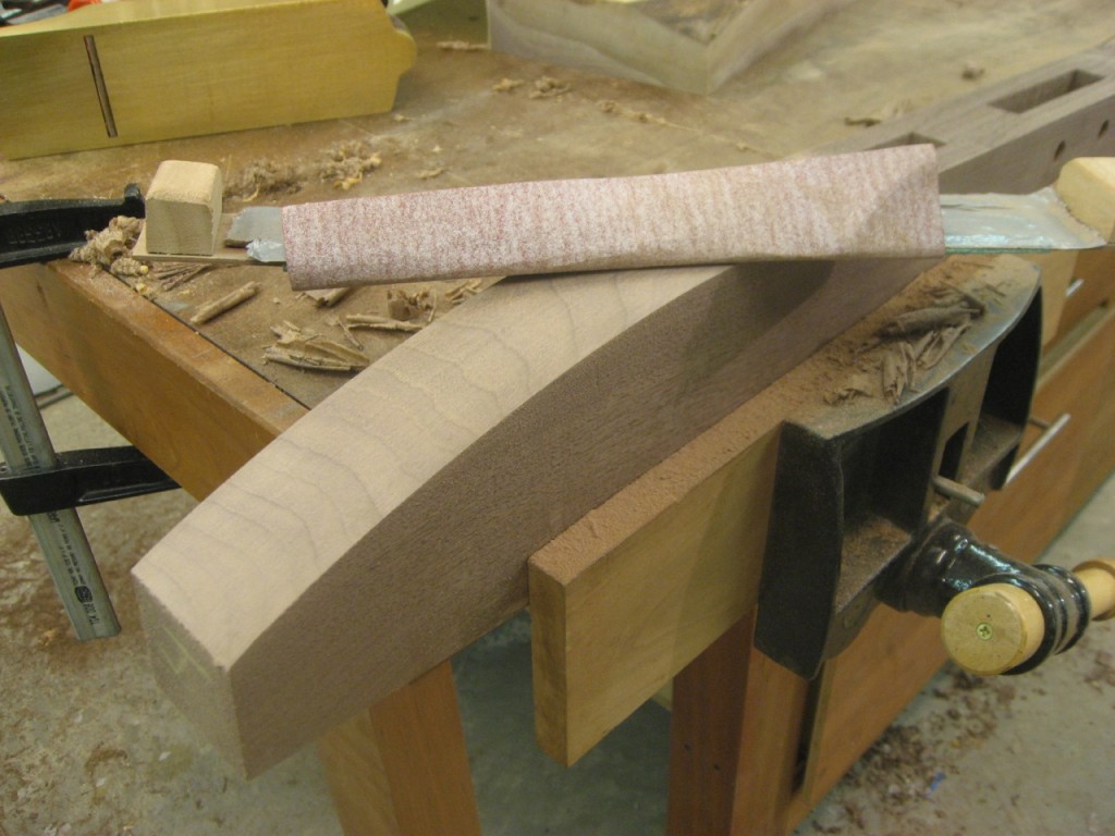 A flexible sanding strip does the final smoothing