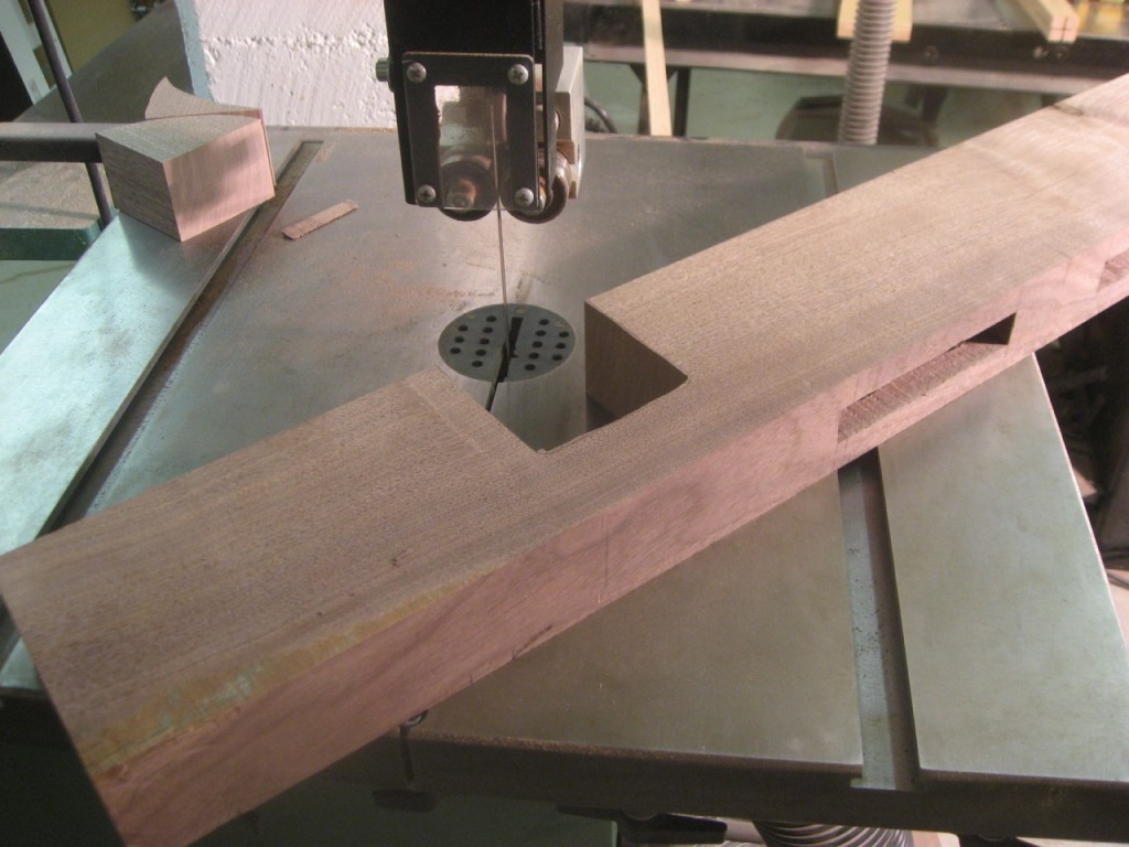 I use the bandsaw to make the cutout for the table slides.