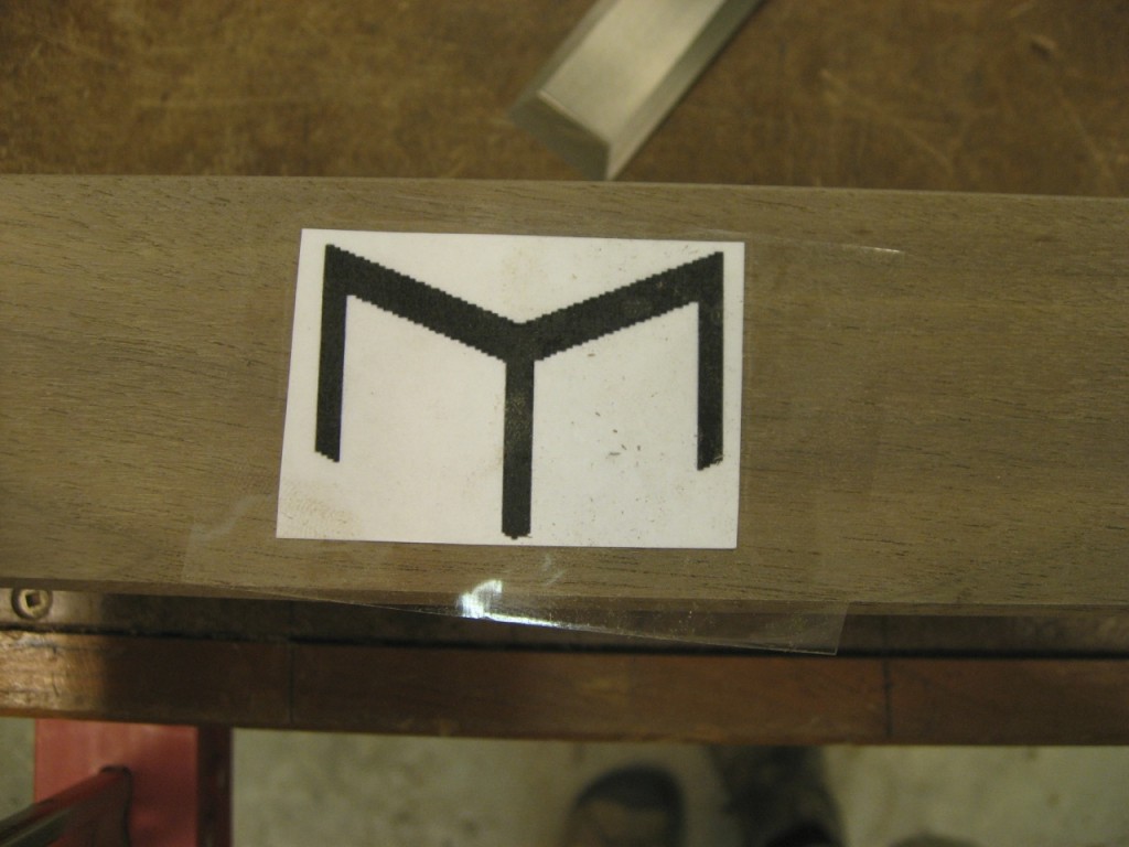 M. Scott Morton logo taped to the wood.