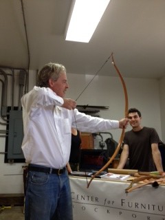 Tom Lie-Nielsen trying out one of the bows made by a student at the Center for Furniture Craftmanship.