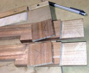 It is approximately 6 inches from the end to the notch just left of the off-cuts, which is from the 5/8” cut. You can also see the large X on the slabs which identified the waste, and the saw marks still on the lap joints before using the router plane.