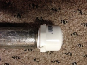 It’s not terribly difficult to cross-thread the soft PVC on steel pipe. To make the cap easier to install and remove at a later date, wrap a layer or two of Teflon thread tape on first.