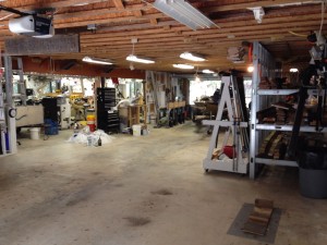 The area we call “garage” includes automobile parking in the foreground, boat parking and wood storage to the right, Brenda’s ceramic studio to the left and my woodshop straight ahead.
