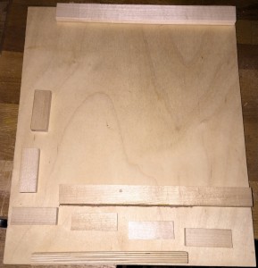 All of the stops are cut to size and laid out on the plywood.