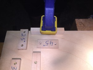 The straight block is clamped against the line to facilitate proper orientation.