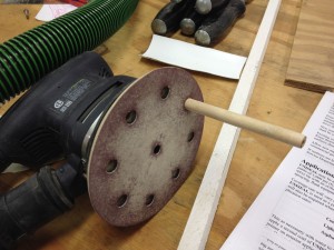 The handle slides into the sander’s pad more easily, and the disk glides down into position with less effort, too.