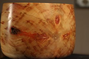 Close-up of box elder bowl showing detail of spalt and red coloration.
